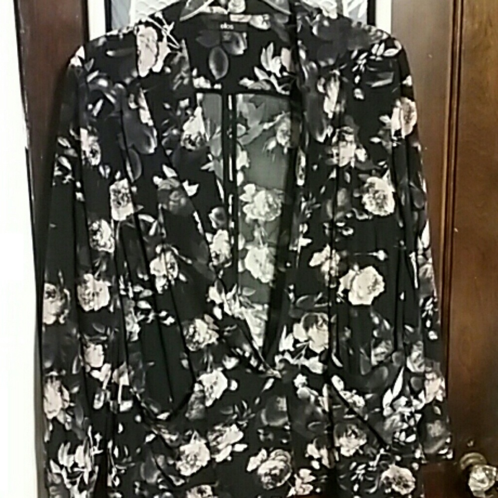 Black blazer with pink and white flowers.